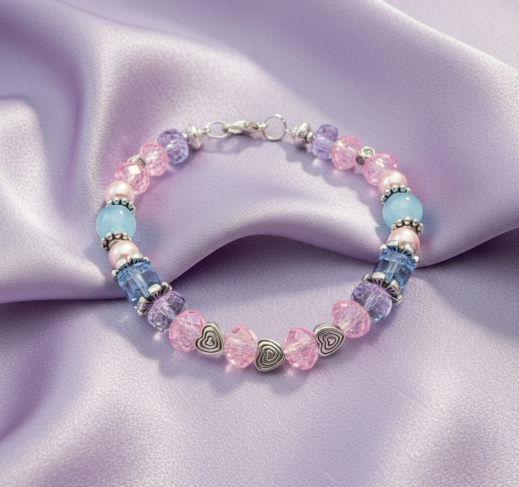 Beaded bracelet with pink and blue beads on a black background