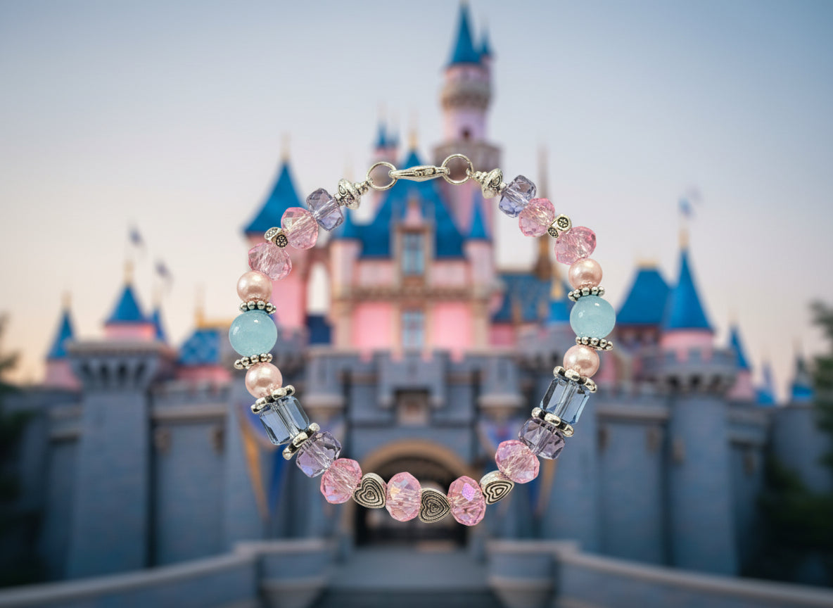 Beaded bracelet with pink, blue, and purple beads on a dark background