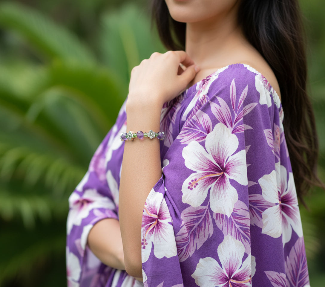 Beaded bracelet with floral designs on a black background