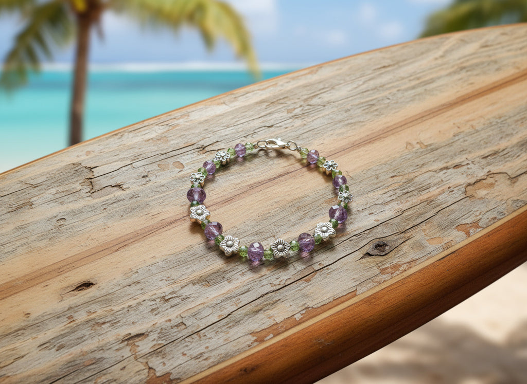 Bracelet with floral and beaded design on a dark background