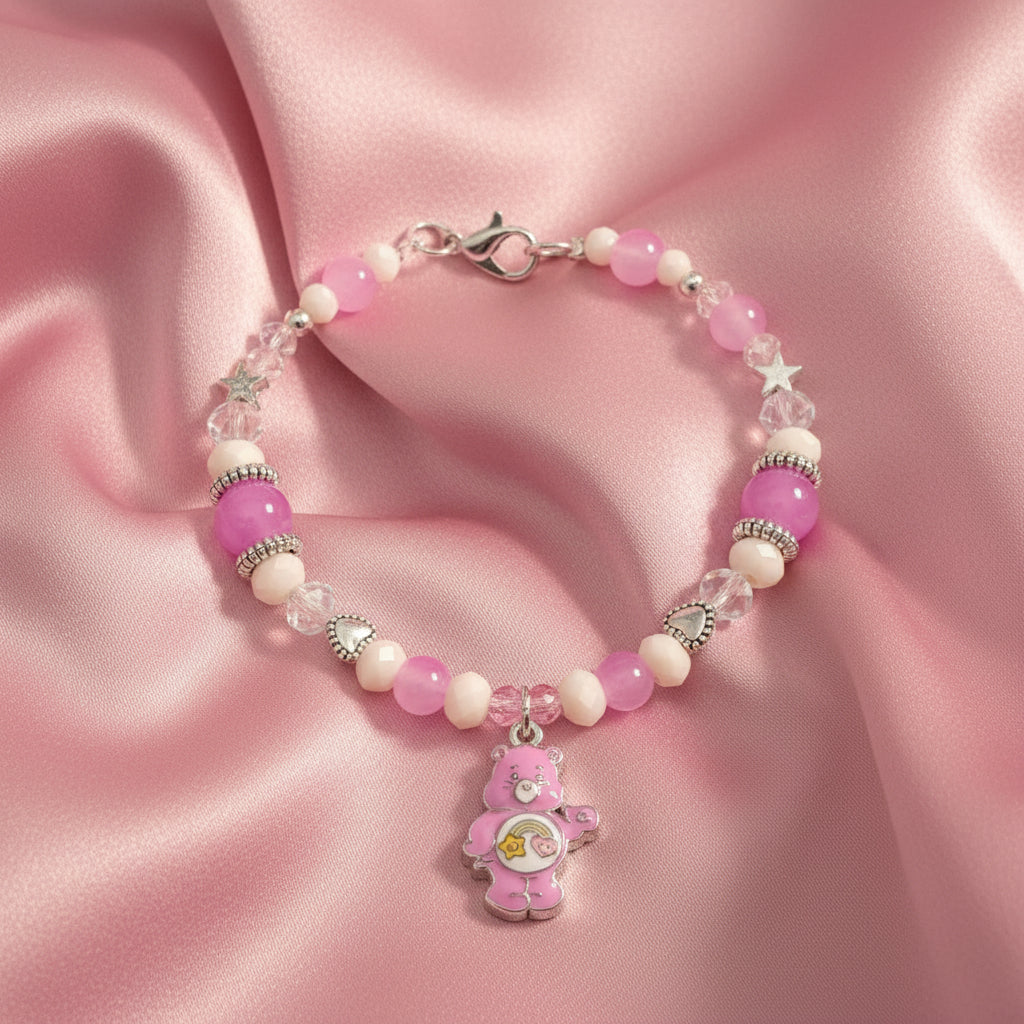 Beaded bracelet with pink and clear beads on a black background