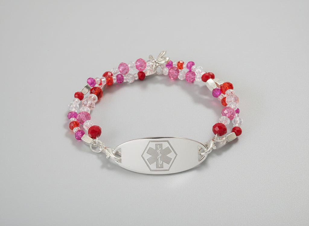 Beaded bracelet with an emergency symbol charm on a black background