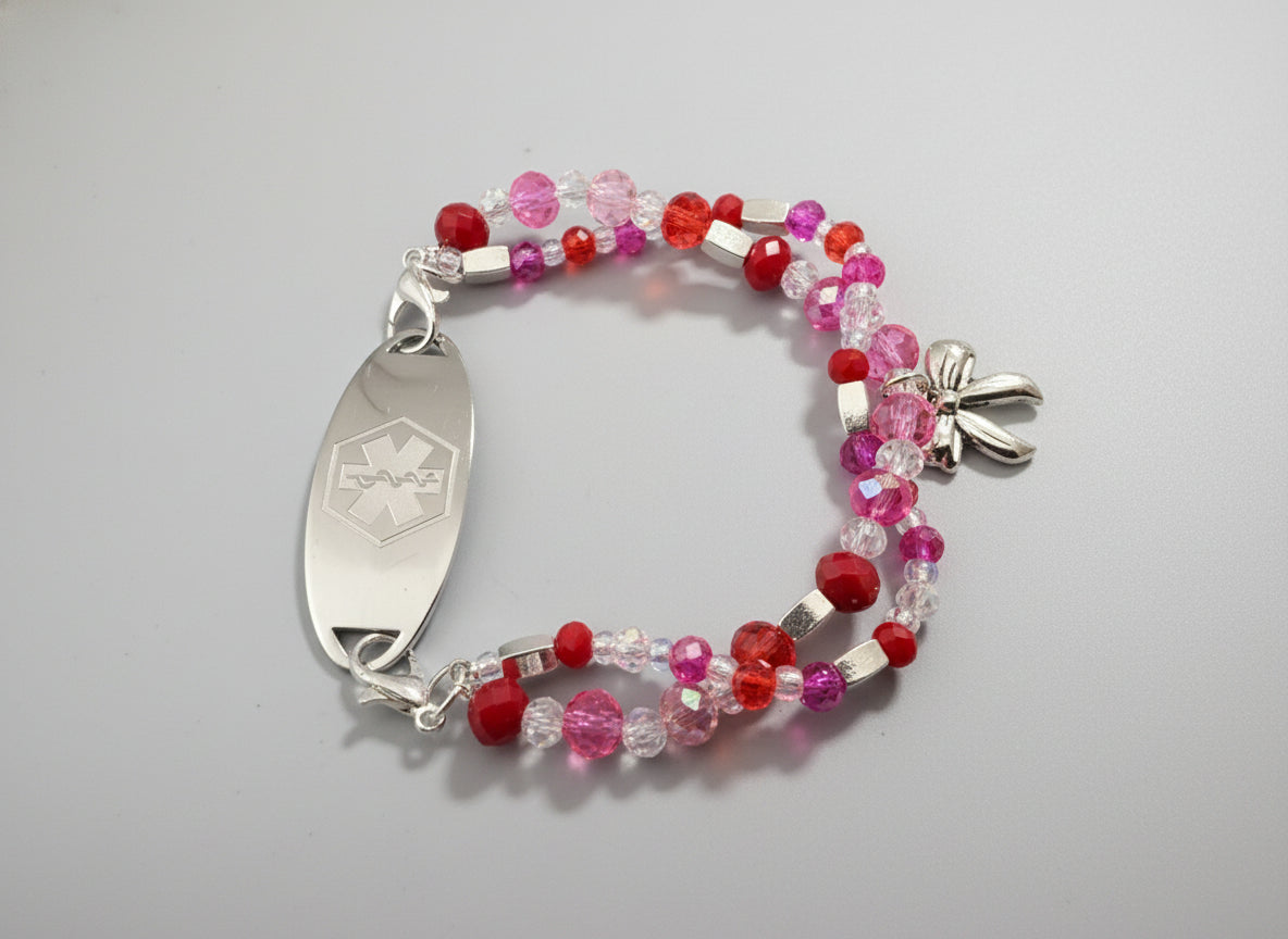 Beaded bracelet with a silver medical ID tag on a black textured background