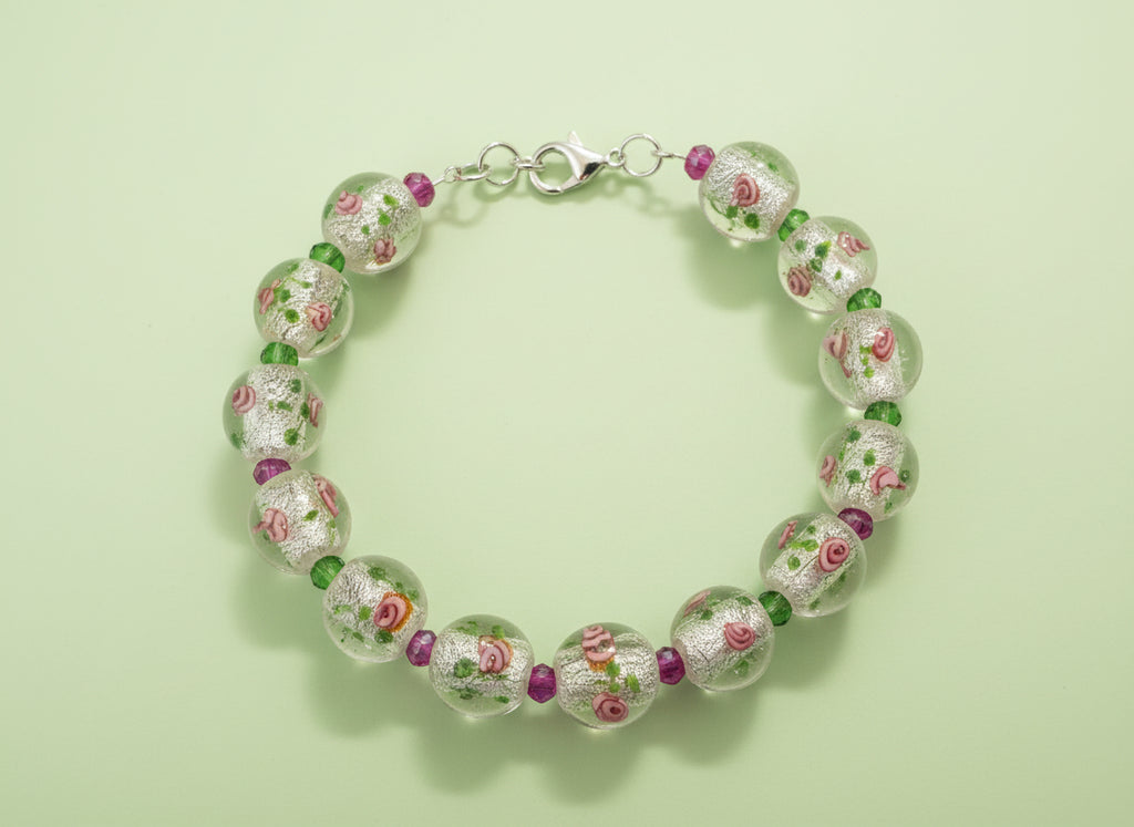 Bracelet with floral beads on a black background