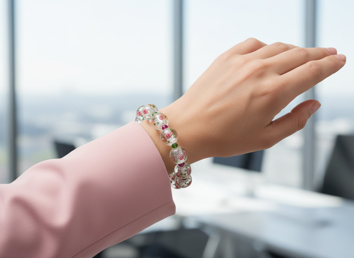 Bracelet with floral glass beads on a dark background