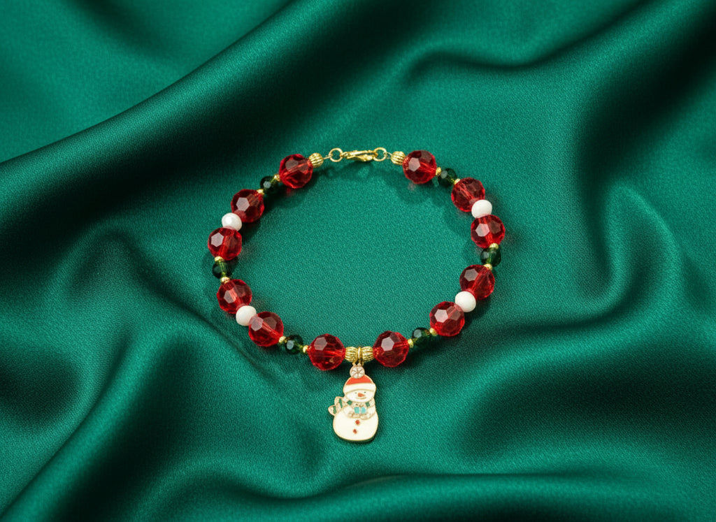 Beaded bracelet with a snowman charm on a dark background