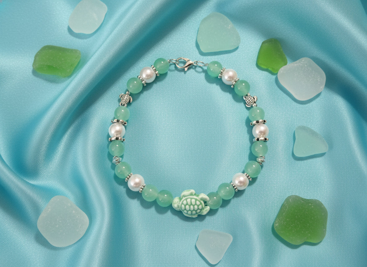 Beaded bracelet with green and white beads on a black background