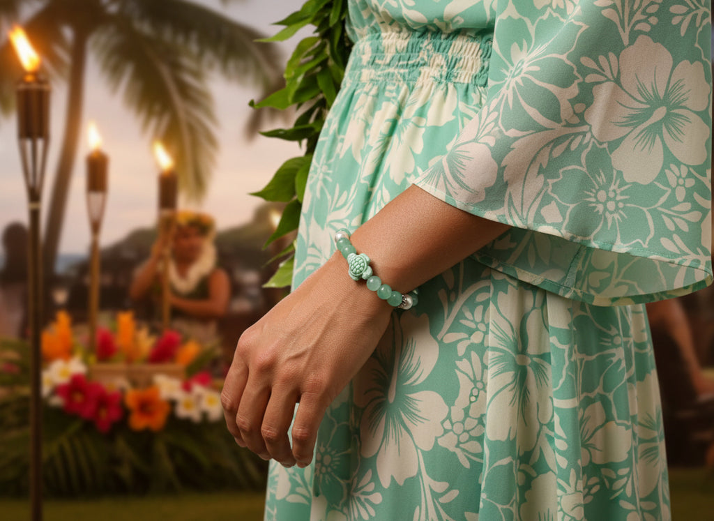 Bracelet with green and pink beads and a turtle charm on a dark background