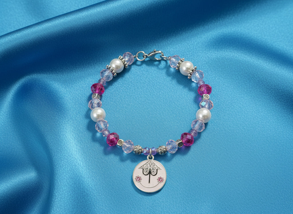 Bracelet with colorful beads and a circular charm on a black background