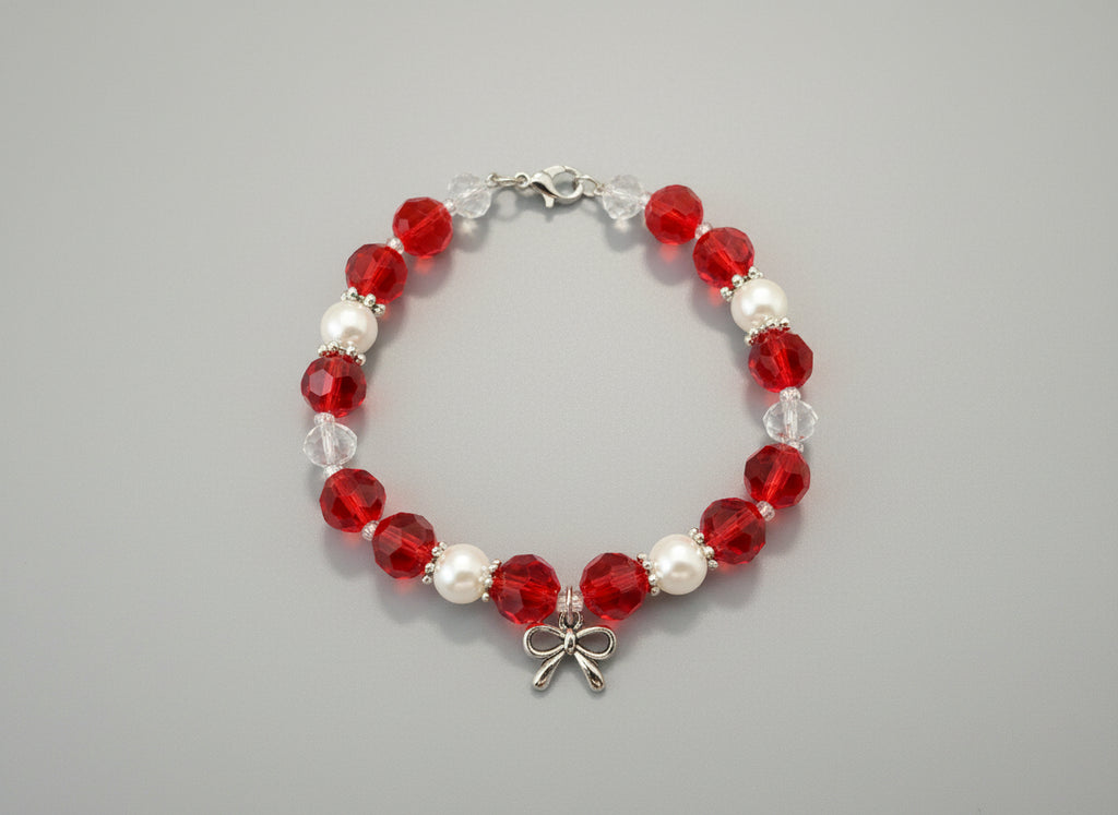 Bracelet with red, white, and clear beads on a dark background