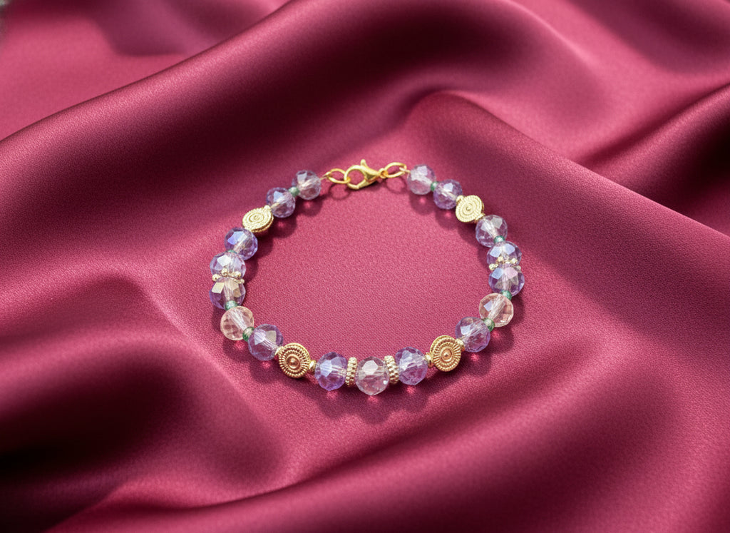 Beaded bracelet with gold accents on a dark background