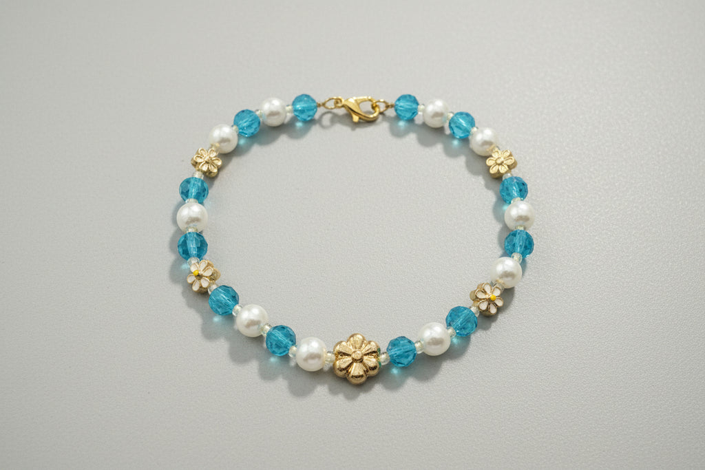 Bracelet with blue and white beads on a dark textured background