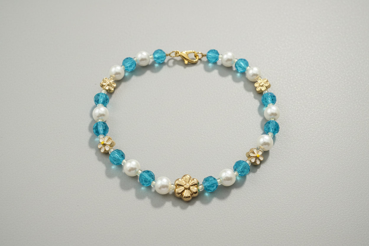 Bracelet with blue and white beads on a dark textured background