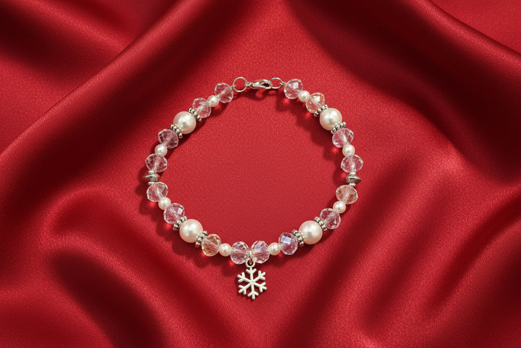 Beaded bracelet with a snowflake charm on a dark background