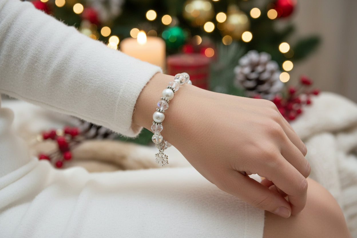 Beaded bracelet with a snowflake charm on a dark textured background