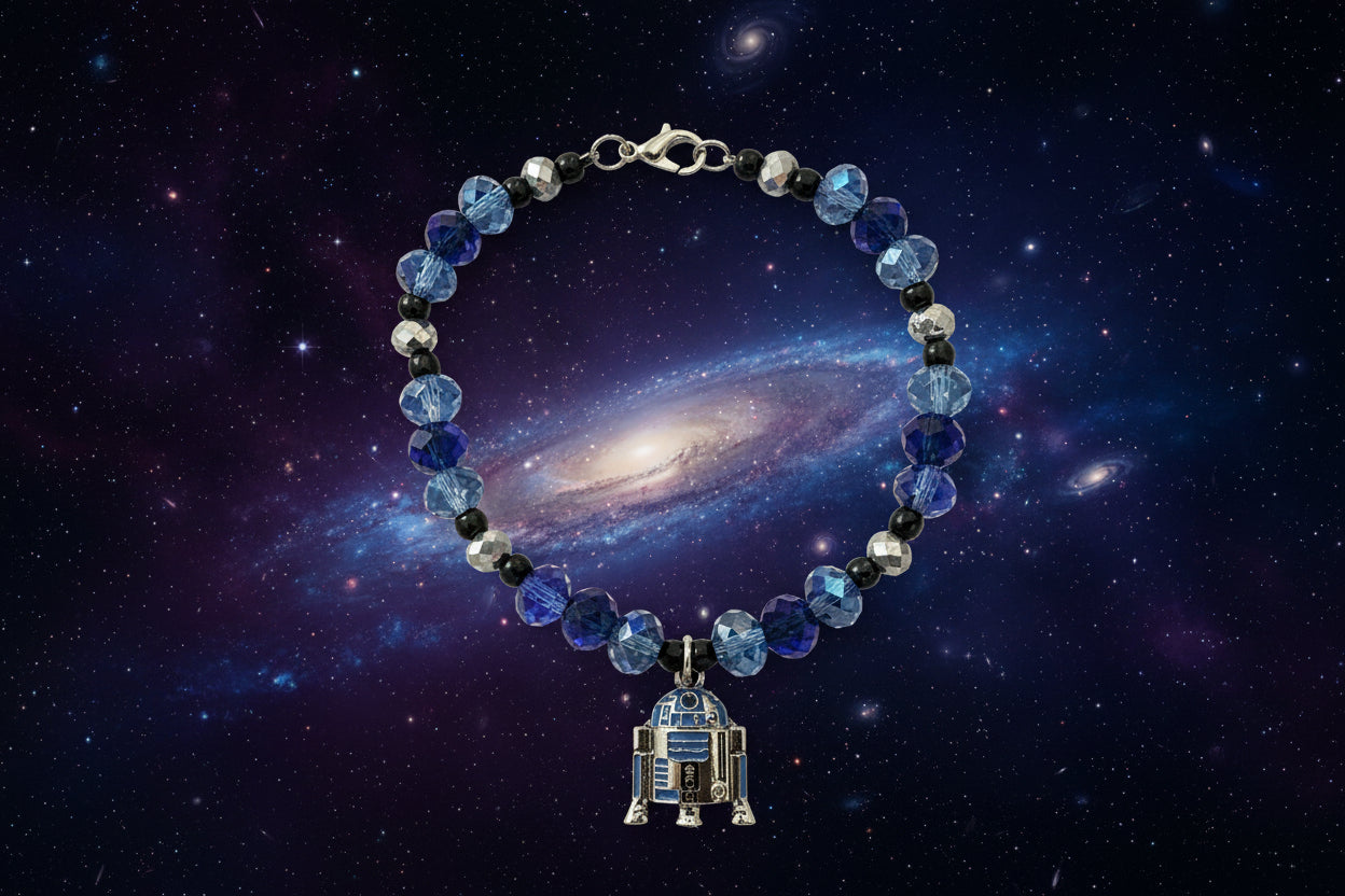 Bracelet with blue and silver beads and a R2D2 charm on a dark background