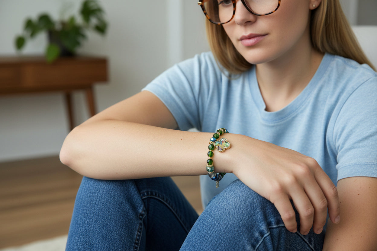 Beaded bracelet with a central pendant on a dark textured background
