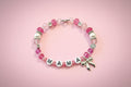 "Mama" Beaded Bow Charm Bracelet - Pink