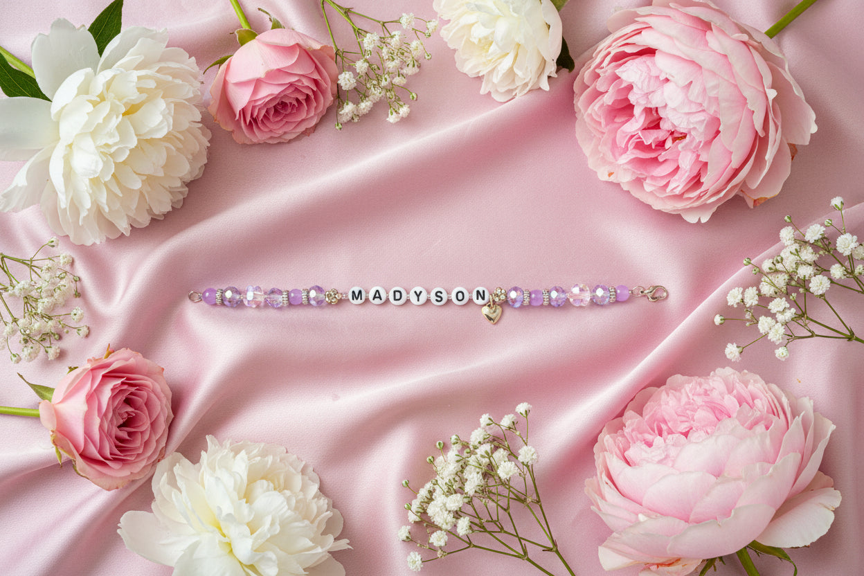 Bracelet with 'MADYSON' on a dark surface