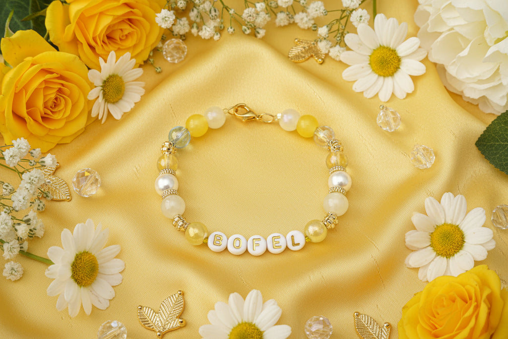 Beaded bracelet with letter beads on a dark textured background