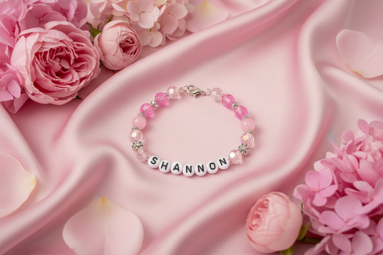 Beaded bracelet with 'SHANNON' name beads on a black background