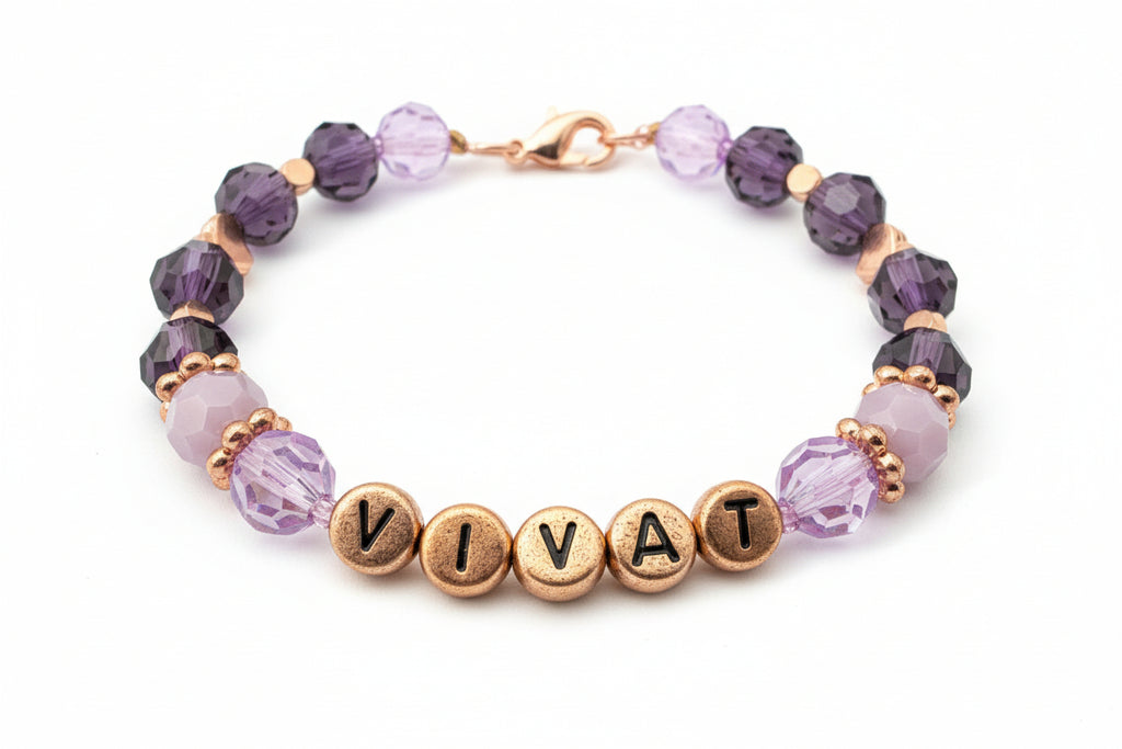 Bracelet with 'VIVA' beads on a dark background