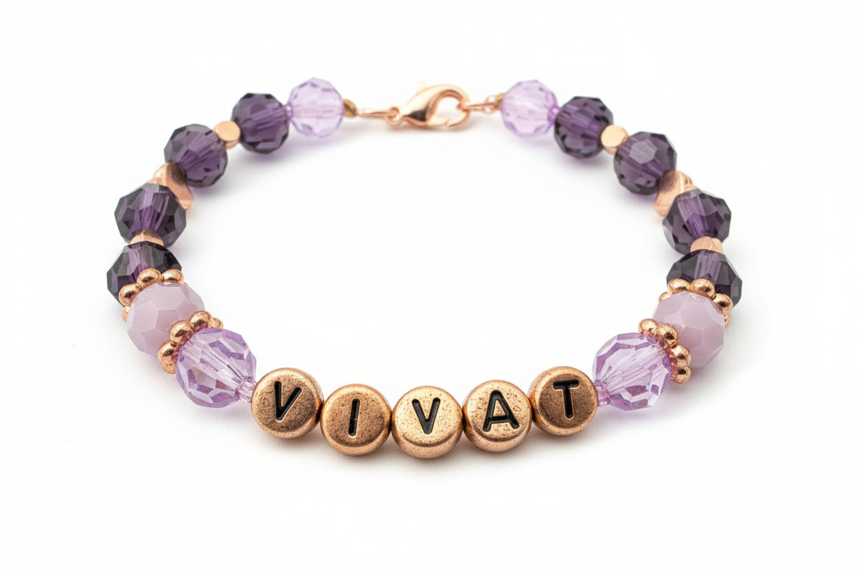 Bracelet with 'VIVA' beads on a dark background