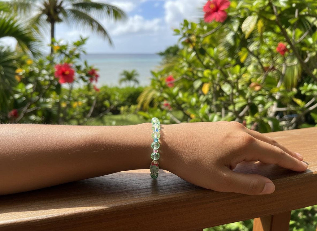 Beaded bracelet with a charm on a dark gray background