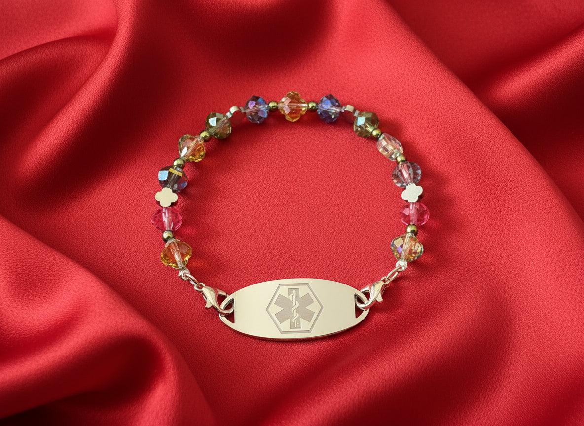 Multicolored beaded bracelet with an emergency symbol charm on a dark background