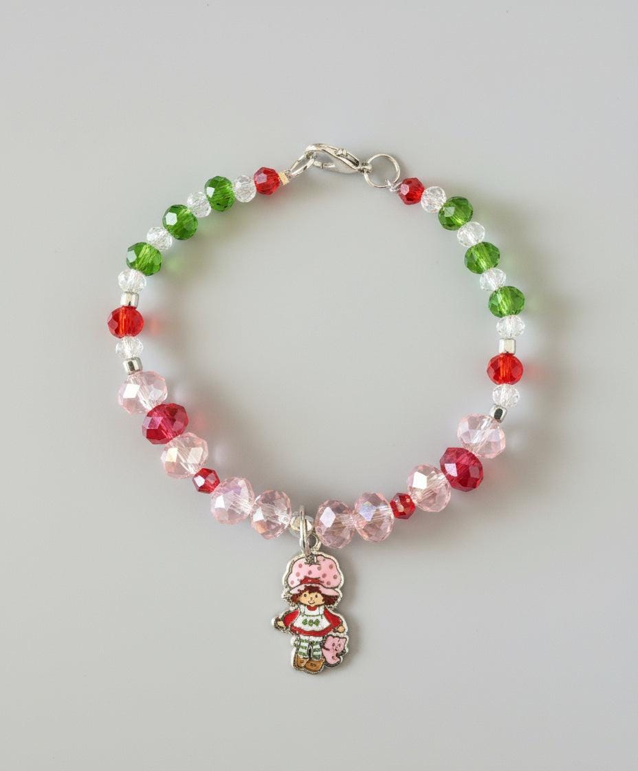 Multicolored beaded bracelet on a dark textured surface