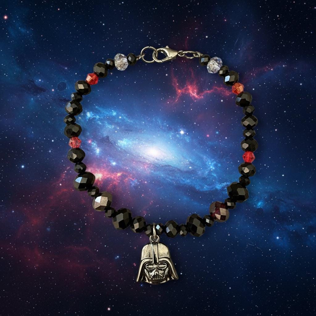 Beaded bracelet with charms on a dark textured surface