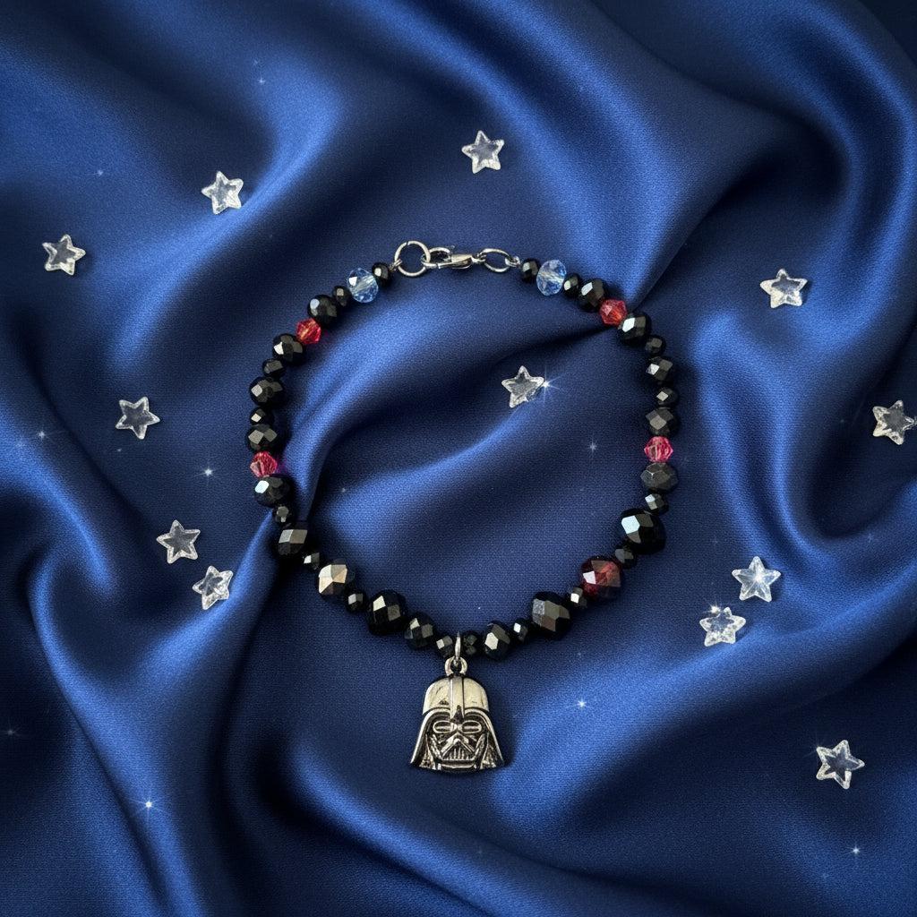 Beaded bracelet with a Darth Vader charm on a dark gray background