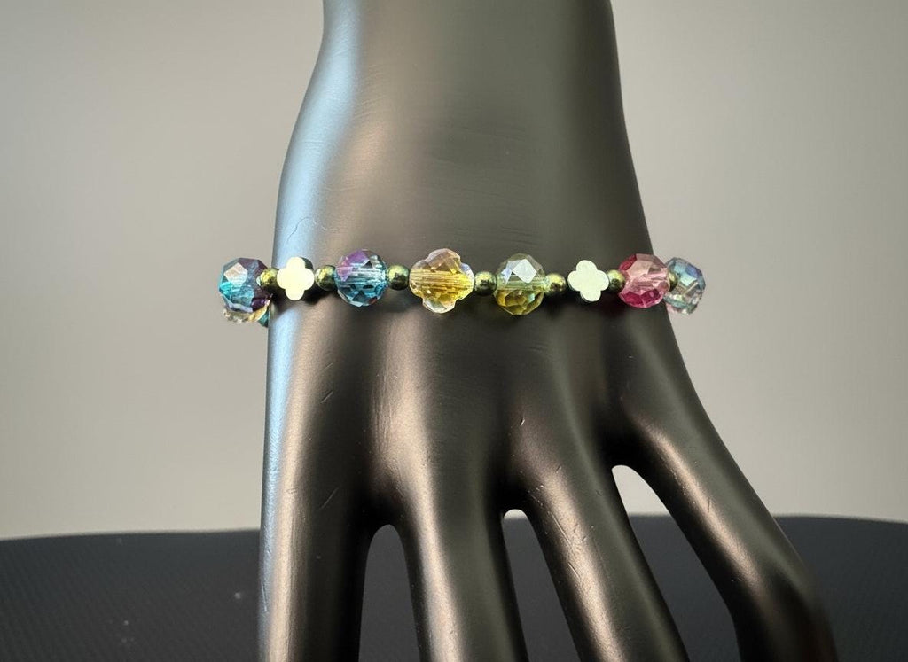 Multicolored beaded bracelet on a black mannequin hand