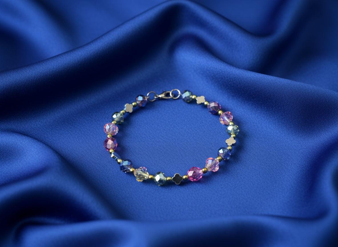 Multicolored beaded bracelet on a dark textured surface