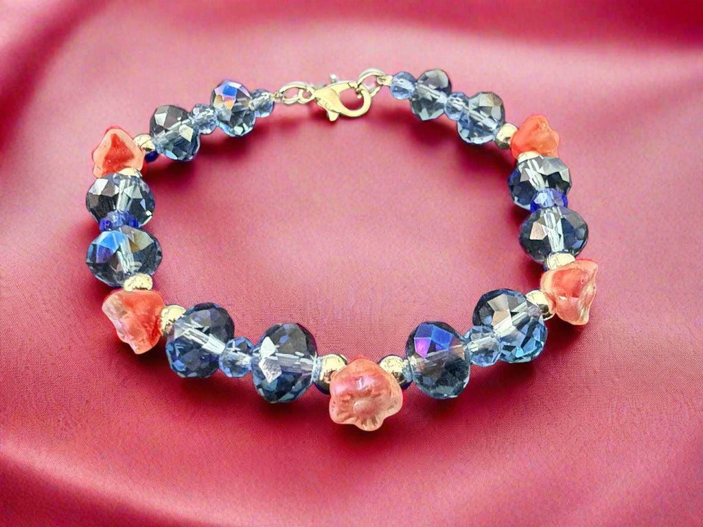 Bracelet with blue and pink beads on a dark textured background