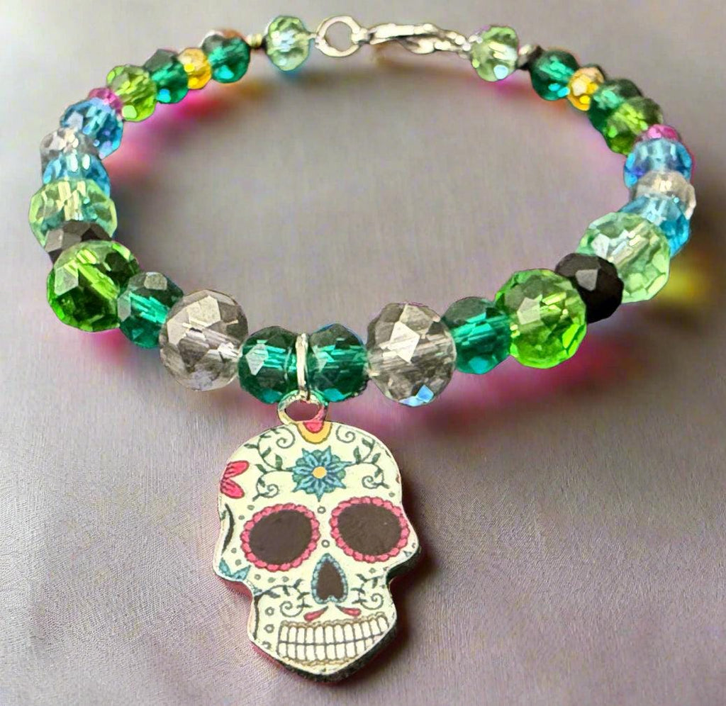 Beaded bracelet with a colorful skull charm on a dark background