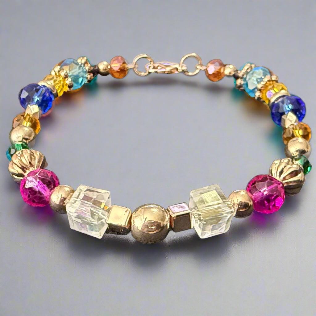 Multicolored beaded bracelet on a dark textured surface
