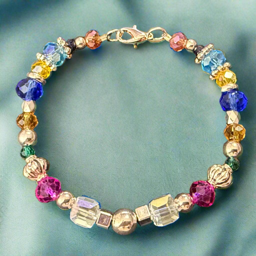 Multicolored beaded bracelet on a dark textured surface