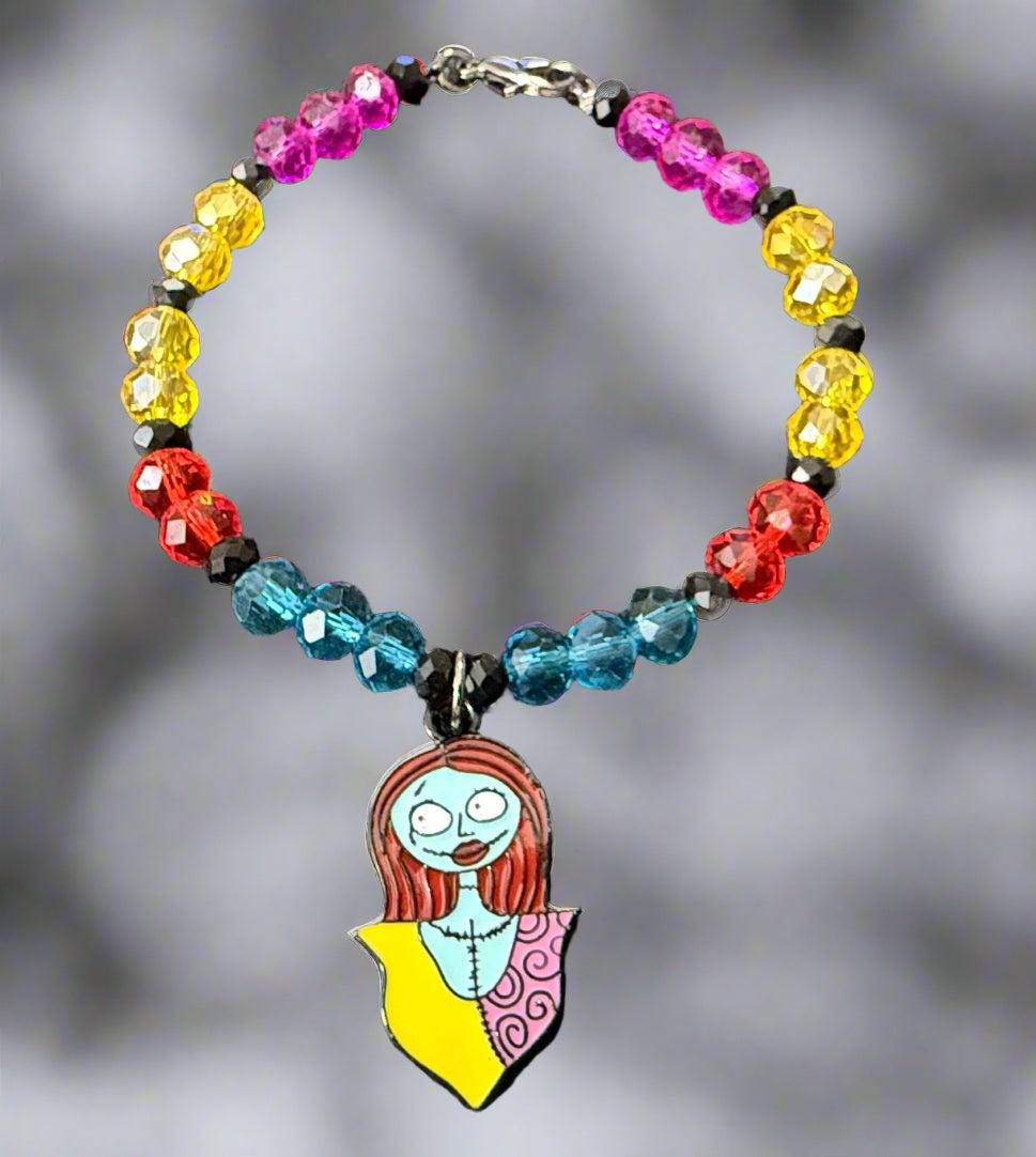 Colorful beaded bracelet with a unique pendant on a dark background