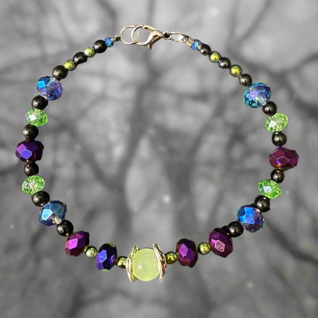 Multicolored beaded bracelet on a dark textured surface