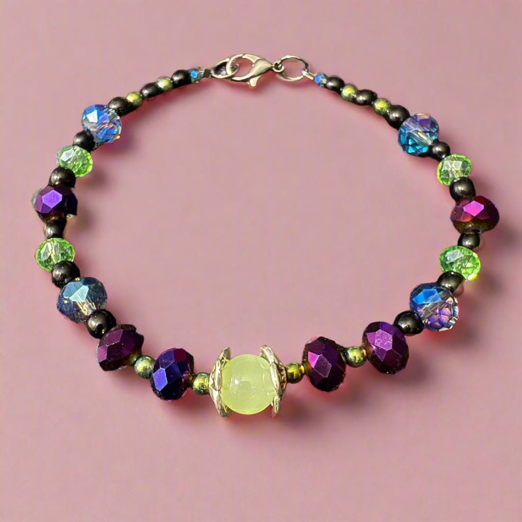 Multicolored beaded bracelet on a dark textured surface