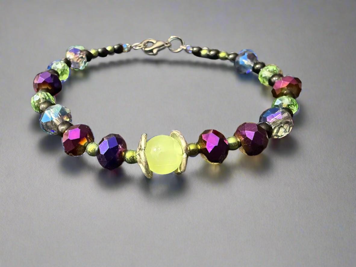 Multicolored beaded bracelet on a dark textured surface