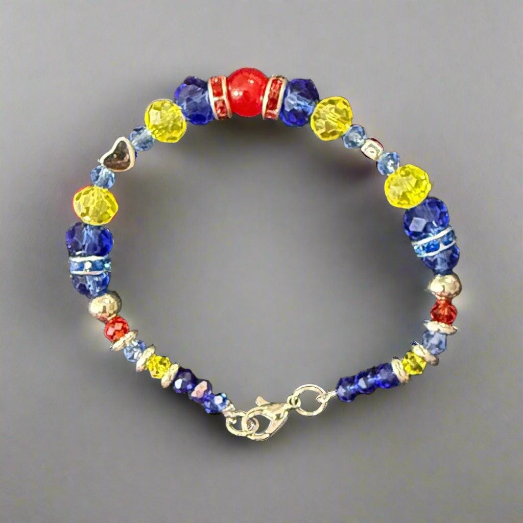 Colorful beaded bracelet on a dark textured surface