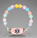 Colorful beaded bracelet with an emergency medical symbol on a dark fabric background