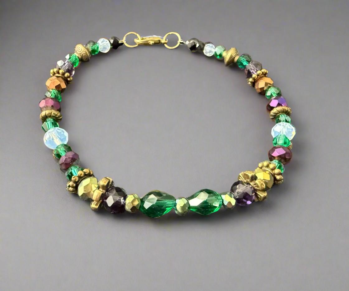 Multicolored beaded bracelet on a dark textured surface