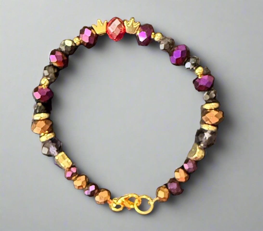 Multicolored beaded bracelet on a dark textured surface