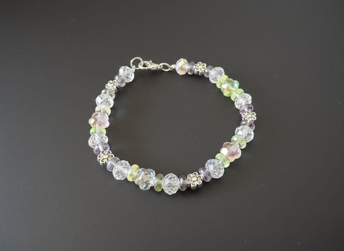 Multicolored beaded bracelet on a dark textured surface