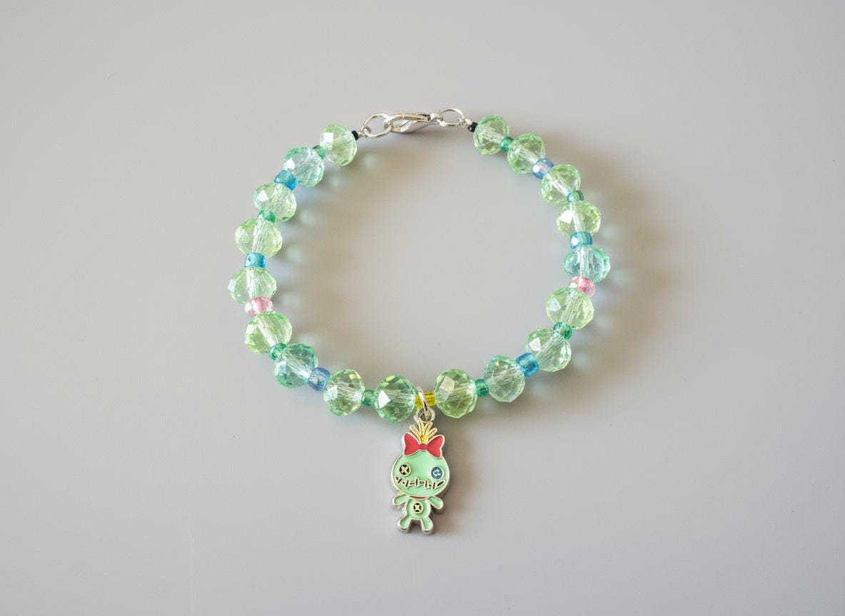 Beaded bracelet with a small charm on a dark textured background