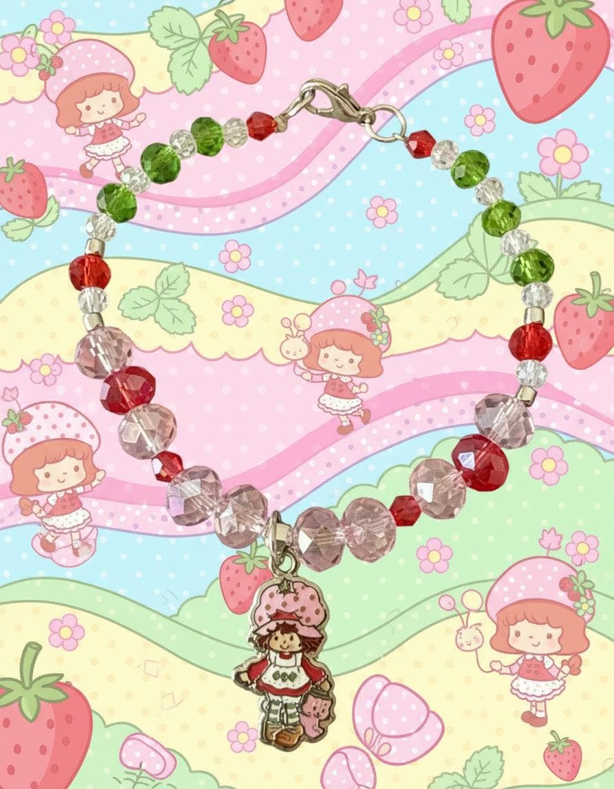 Beaded bracelet with a charm on a dark textured surface