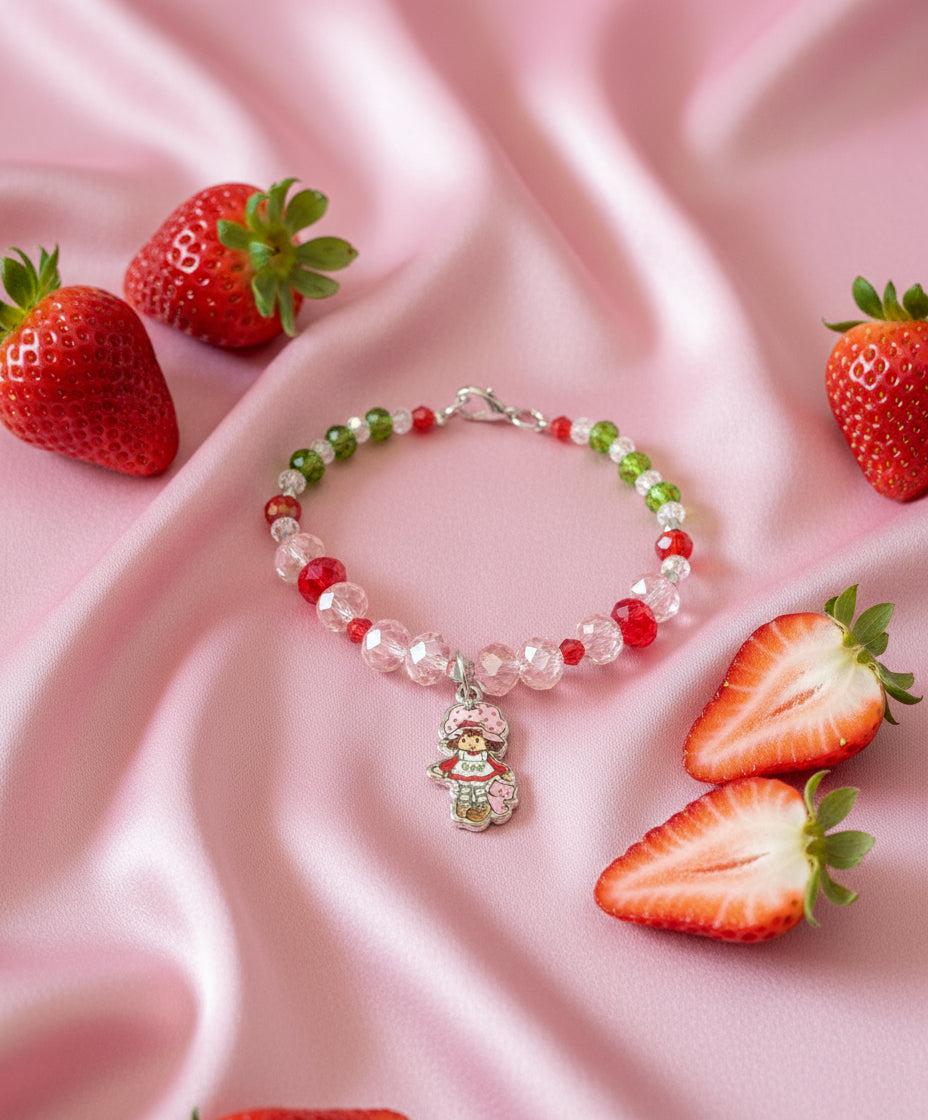 Beaded bracelet with a charm on a dark textured surface